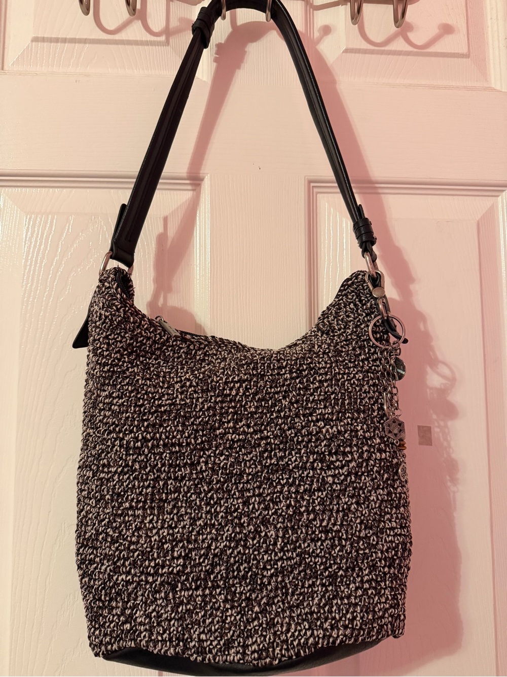 The Sak Black and Cream Woven Shoulder Bag with Charm Accent